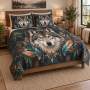 Boho Wolf Feather Nature Quilt Set on a bed, angled view showing the quilt design and two coordinating pillow shams