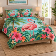 Tropical Flamingo Hibiscus Beach Quilt Set on a bed, angled view showing the quilt design and two coordinating pillow shams