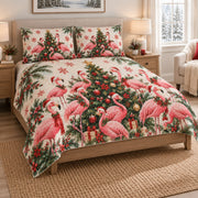 Christmas Flamingo Tropical Holiday Quilt Set on a bed, angled view showing the quilt design and two coordinating pillow shams