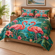 Tropical Flamingo Love Floral Quilt Set on a bed, angled view showing the quilt design and two coordinating pillow shams
