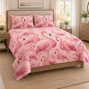 Pink Flamingo Tropical Garden Quilt Set on a bed, angled view showing the quilt design and two coordinating pillow shams