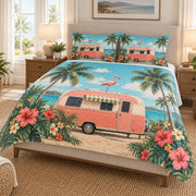 Tropical Flamingo Camper Beach Quilt Set on a bed, angled view showing the quilt design and two coordinating pillow shams