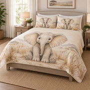 Neutral Baby Elephant Safari Quilt Set on a bed, angled view showing the quilt design and two coordinating pillow shams