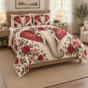 Romantic Elephant Rose Floral Quilt Set on a bed, angled view showing the quilt design and two coordinating pillow shams