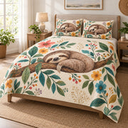 Sleeping Sloth Floral Nature Quilt Set on a bed, angled view showing the quilt design and two coordinating pillow shams
