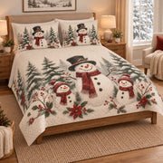Christmas Snowman Family Forest Quilt Set on a bed, angled view showing the quilt design and two coordinating pillow shams