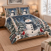 Snowman Cardinal Winter Forest Quilt Set on a bed, angled view showing the quilt design and two coordinating pillow shams