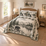 Black bear lakeside country toile quilt set from an angled view, with both pillow shams