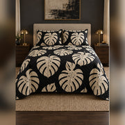 Black and Cream Monstera Quilt Set, front monstera leaf bedroom view