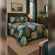 Teal and Ochre Monstera Quilt Set, angled monstera leaf bedroom view