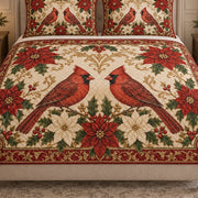 Close view of the Christmas Cardinal Pair Poinsettia quilt artwork and two matching shams