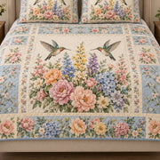 Close view of the Vintage-inspired Hummingbird Wildflower Patchwork quilt artwork and two matching shams