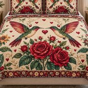 Close view of the Hummingbird Rose Love quilt artwork and two matching shams