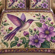 Close view of the Purple Hummingbird Floral quilt artwork and two matching shams