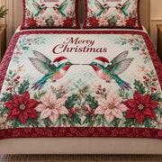 Close view of the Christmas Hummingbird Poinsettia quilt artwork and two matching shams
