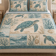 Close view of the Sea Turtle Coastal Patchwork quilt artwork and two matching shams