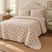 Red Clover ditsy garden floral quilt set, right oblique angle view