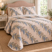 California lilac quilt set, left oblique bedroom view with blue garland print and diamond stitching, AI-generated mockup