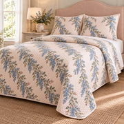 California lilac quilt set, right oblique bedroom view with blue garland print and diamond stitching, AI-generated mockup
