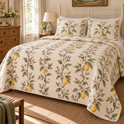 Lemon Blossom orchard quilt set, left bedroom view, white lemon flowers and fruit with diamond quilting, AI-generated mockup