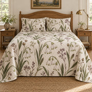 Summer snowflake heirloom herbarium quilt set, centered front cottage bedroom view with diamond quilting, AI-generated mockup