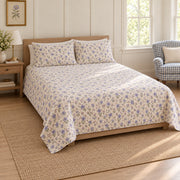 AI-generated mockup, pulled-back front-left view of Balloon Flower quilt set with matching pillows and diamond quilting.