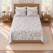 Coral cherry blossom quilt set, elevated straight-on overhead view