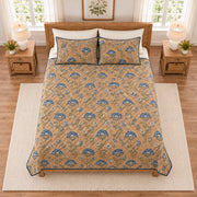 Warm camel and indigo block print floral quilt set overhead view