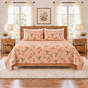 Soft peach hummingbird and fuchsia quilt set front view