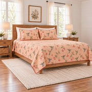 Soft peach hummingbird and fuchsia quilt set left angle
