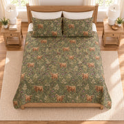 Muted olive Highland cow and thistle quilt set overhead view
