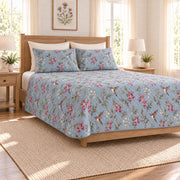 Dusty blue hummingbird and fuchsia quilt set left angle