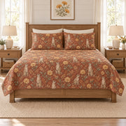 Warm terracotta meerkat and desert marigold quilt set, front hero view