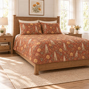 Warm terracotta meerkat and desert marigold quilt set, left angle view
