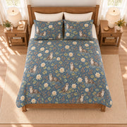 Dusty denim river otter and water lily quilt set, elevated overhead view