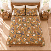 Warm ochre raccoon and magnolia quilt set overhead view