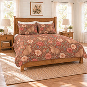 Warm terracotta capybara and zinnia quilt set left angle