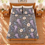 Soft charcoal jellyfish and moonflower quilt set, elevated overhead view