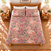 Dusty rose flamingo and bougainvillea quilt set, elevated overhead view