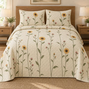 AI mockup, front bedroom view of a sunflower quilt with slender sunflower stems and small pink flowers and two matching printed pillow covers.