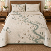 AI mockup, front bedroom view of a moose quilt with moose hoof tracks and a winding creek map and two matching printed pillow covers.