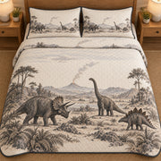 AI mockup, high overhead bedroom view of a dinosaur quilt with three illustrated dinosaurs among ferns before a distant volcano in gray and cream and two matching printed pillow covers.