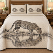 AI mockup, front bedroom view of a leopard quilt with drinking leopard and its waterhole reflection and two matching printed pillow covers.