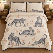 AI mockup, high overhead bedroom view of a leopard quilt with five leopard poses in a line-art wildlife study and two matching printed pillow covers.