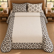 AI mockup, high overhead bedroom view of a leopard quilt with leopard rosette border around a cream center and two matching printed pillow covers.