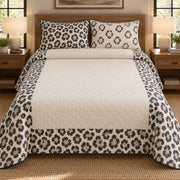 AI mockup, front bedroom view of a leopard quilt with leopard rosette border around a cream center and two matching printed pillow covers.