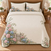 AI mockup, high overhead bedroom view of a hydrangea quilt with wooden garden gate surrounded by hydrangeas and two matching printed pillow covers.