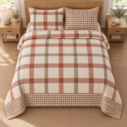 AI mockup, high overhead bedroom view of a gingham quilt with oversized terracotta and sage window checks and two matching printed pillow shams.