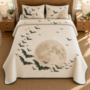 AI mockup, high overhead bedroom view of a Halloween quilt with bats sweeping around a sand-colored moon and two matching printed pillow covers.
