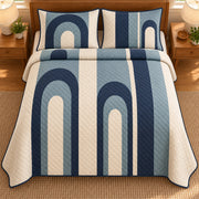 AI mockup, high overhead bedroom view of a mid century modern quilt with navy and muted blue nested arches arranged in vertical cream columns and two matching printed pillow covers.